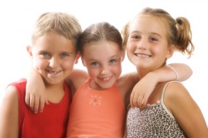 3 kids smiling